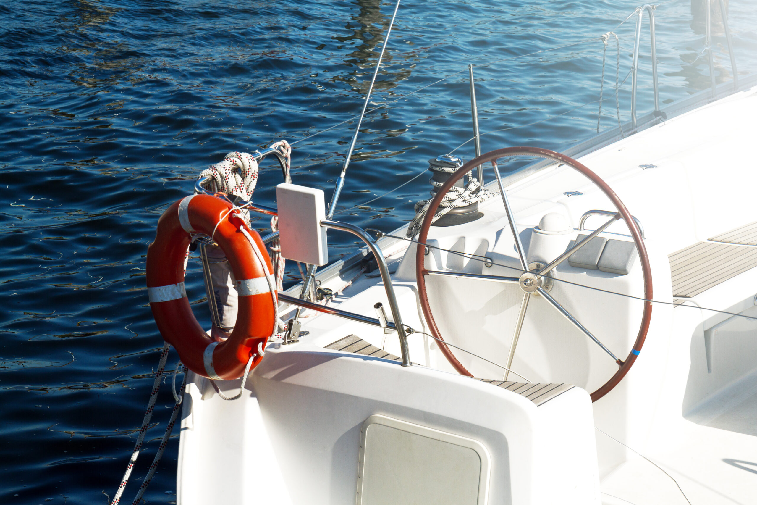 Closeup Of Beautiful Yacht Rudder. Daylight. Horizontal. Sea Bac